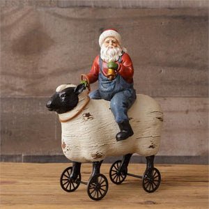 Primitive Santa Riding Sheep